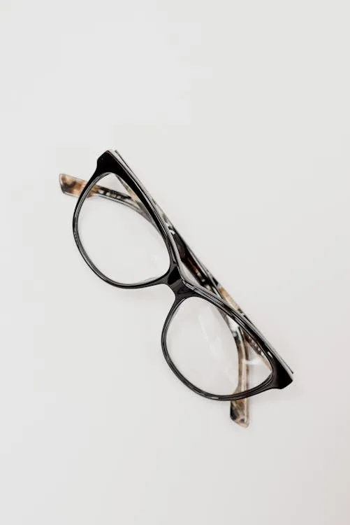Eye examination chart and trial lens frame used during refraction testing for glasses prescription at an optometrist appointment