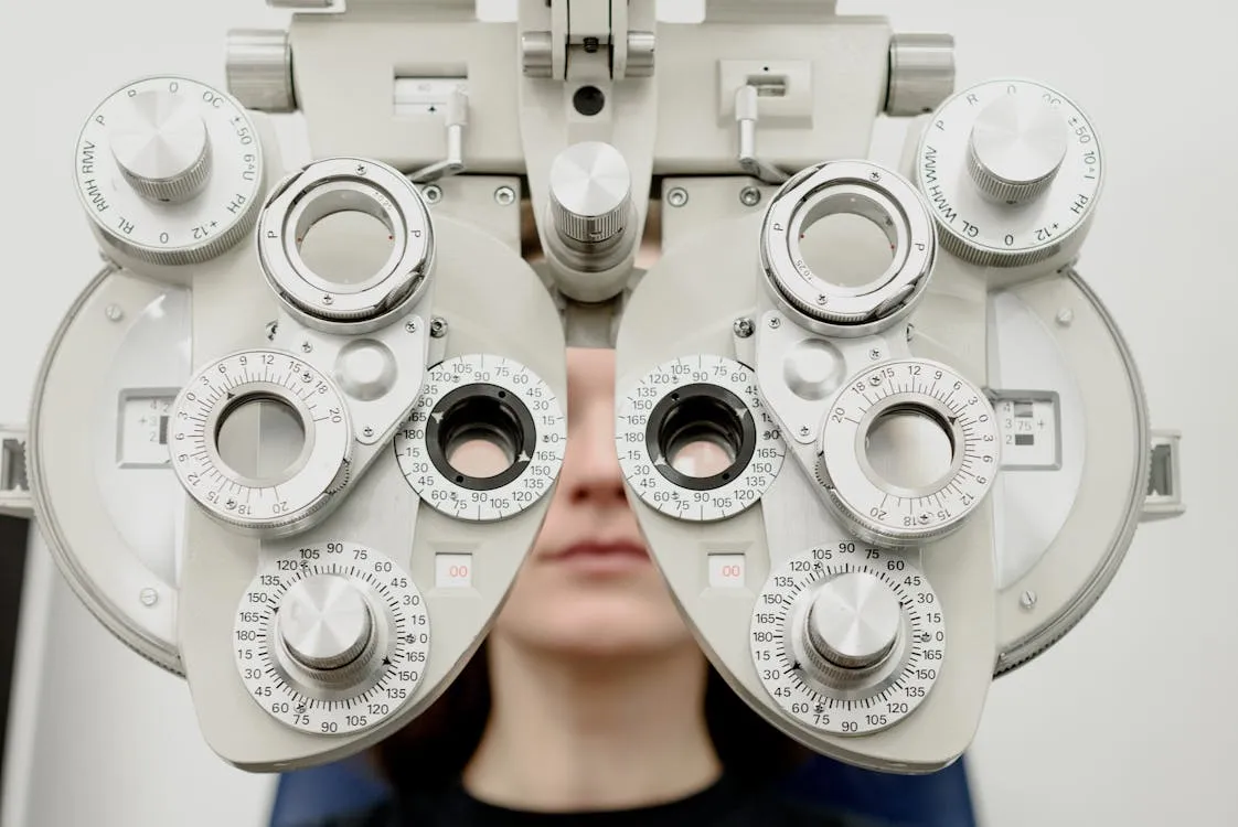 Optometrist reviewing an eye examination result with a patient