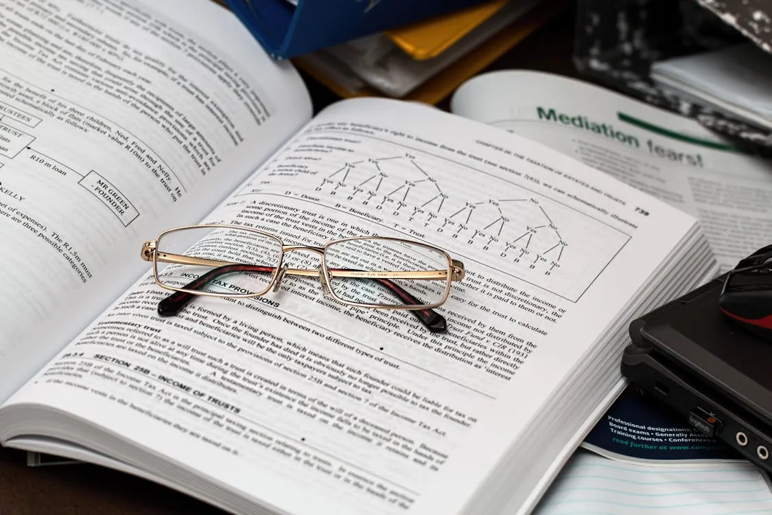 Eyeglasses resting on an open book